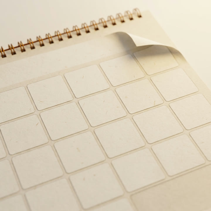 A wall calendar with an empty month grid.